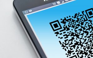 mobile phone with qr code on screen