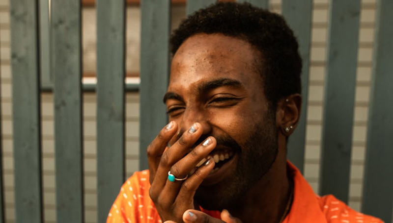 young man smiling and laughing