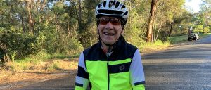 leep volunteer tech mate outside smiling on bike