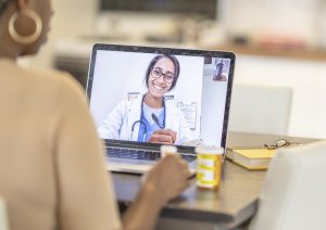 doctor and patient having appointment over the computer