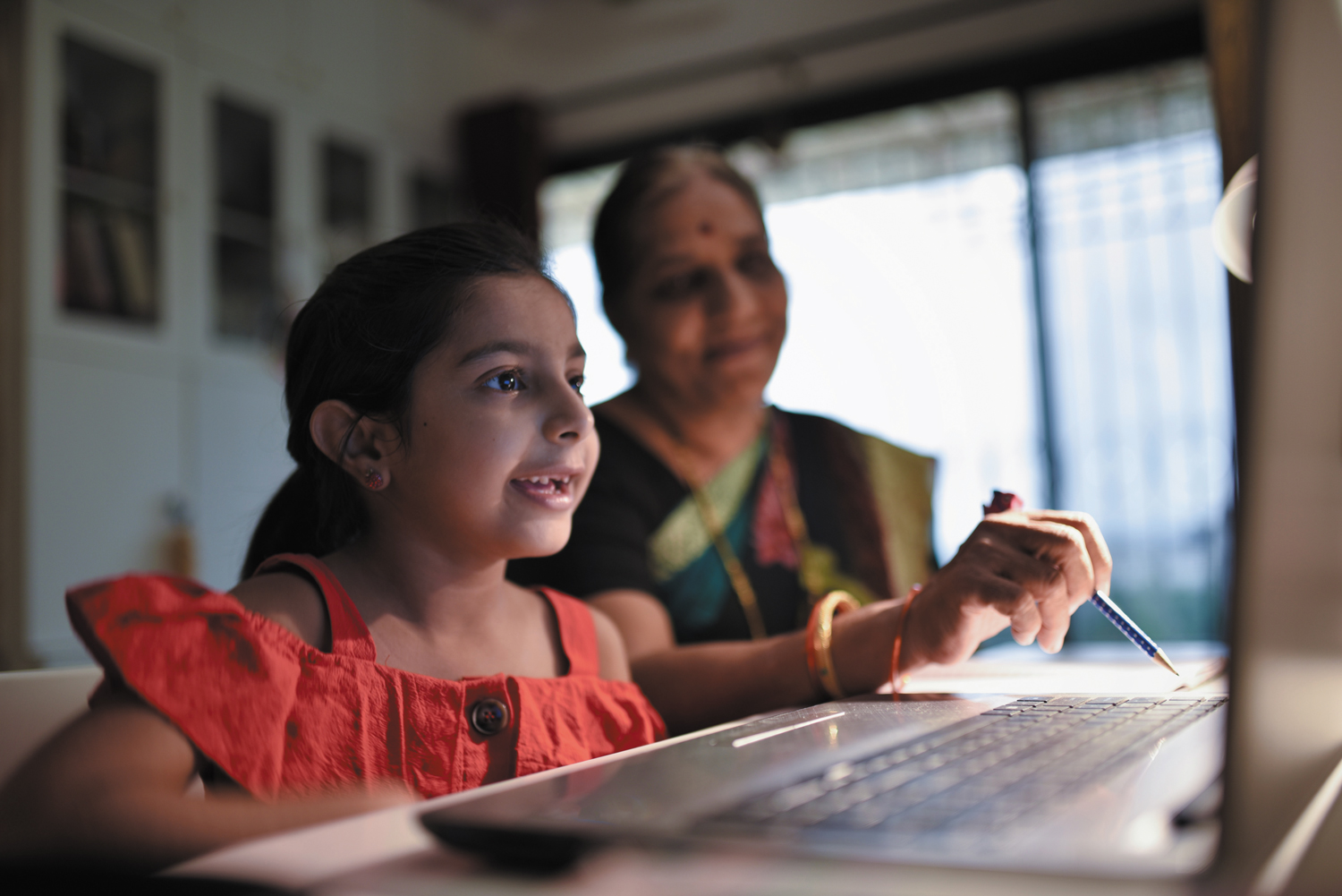 A child using a computer for remote learning.